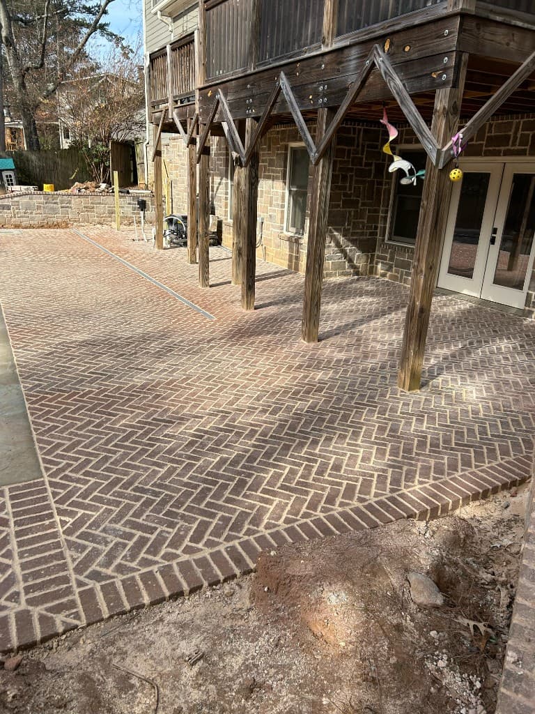 Brick patio under covered deck area