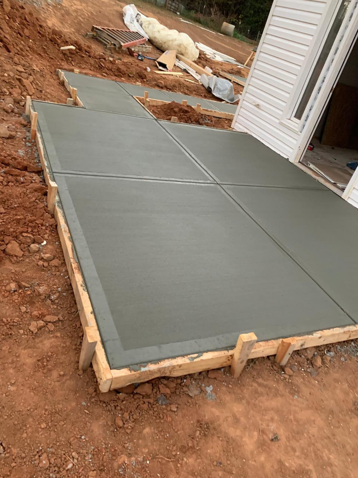 Fresh concrete patio and walkway pours