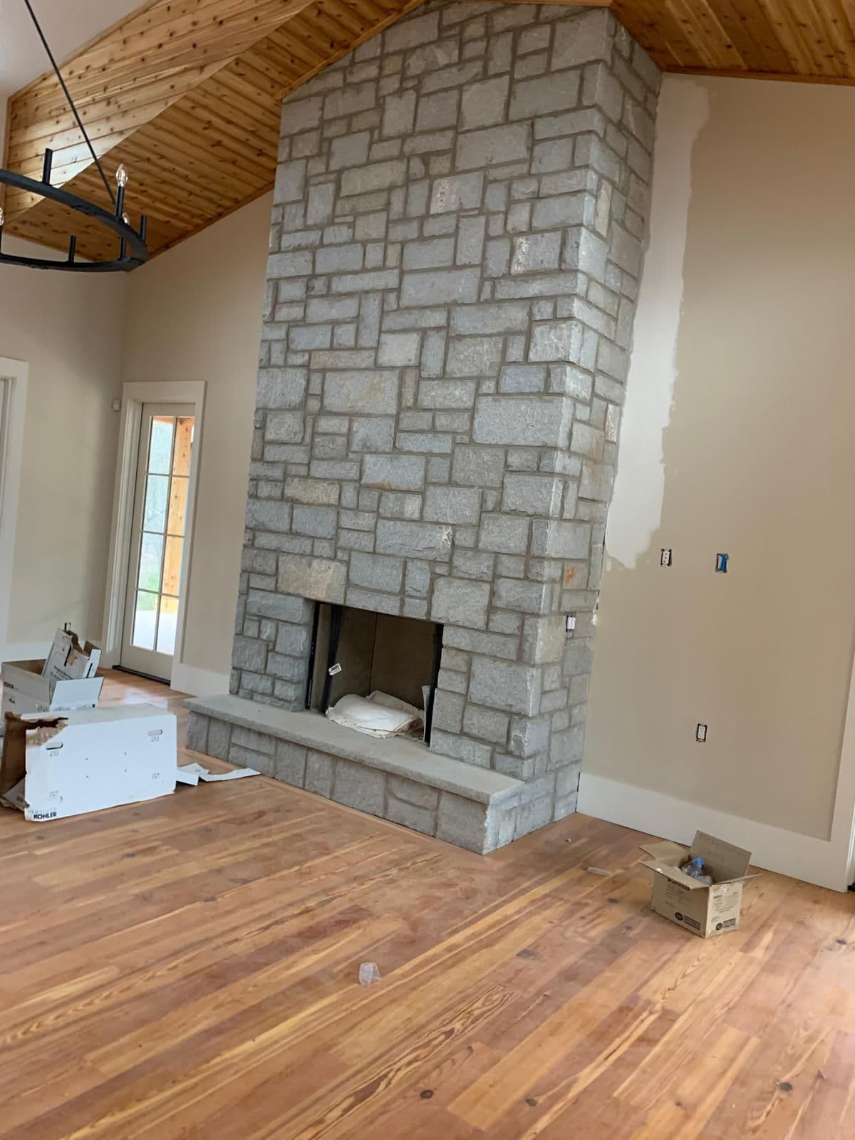 Stone fireplace in finished living room