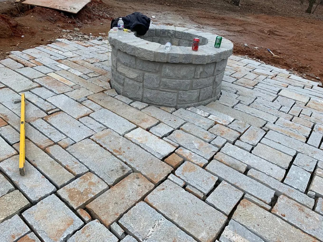 Fire pit and outdoor seating area in North Atlanta, GA by Escobar Masonry & Hardscapes