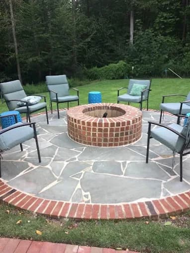 Hardscape installation with paver patio and fire pit